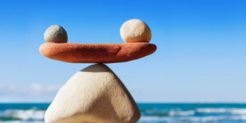 Zen rocks balanced with the sea at the background